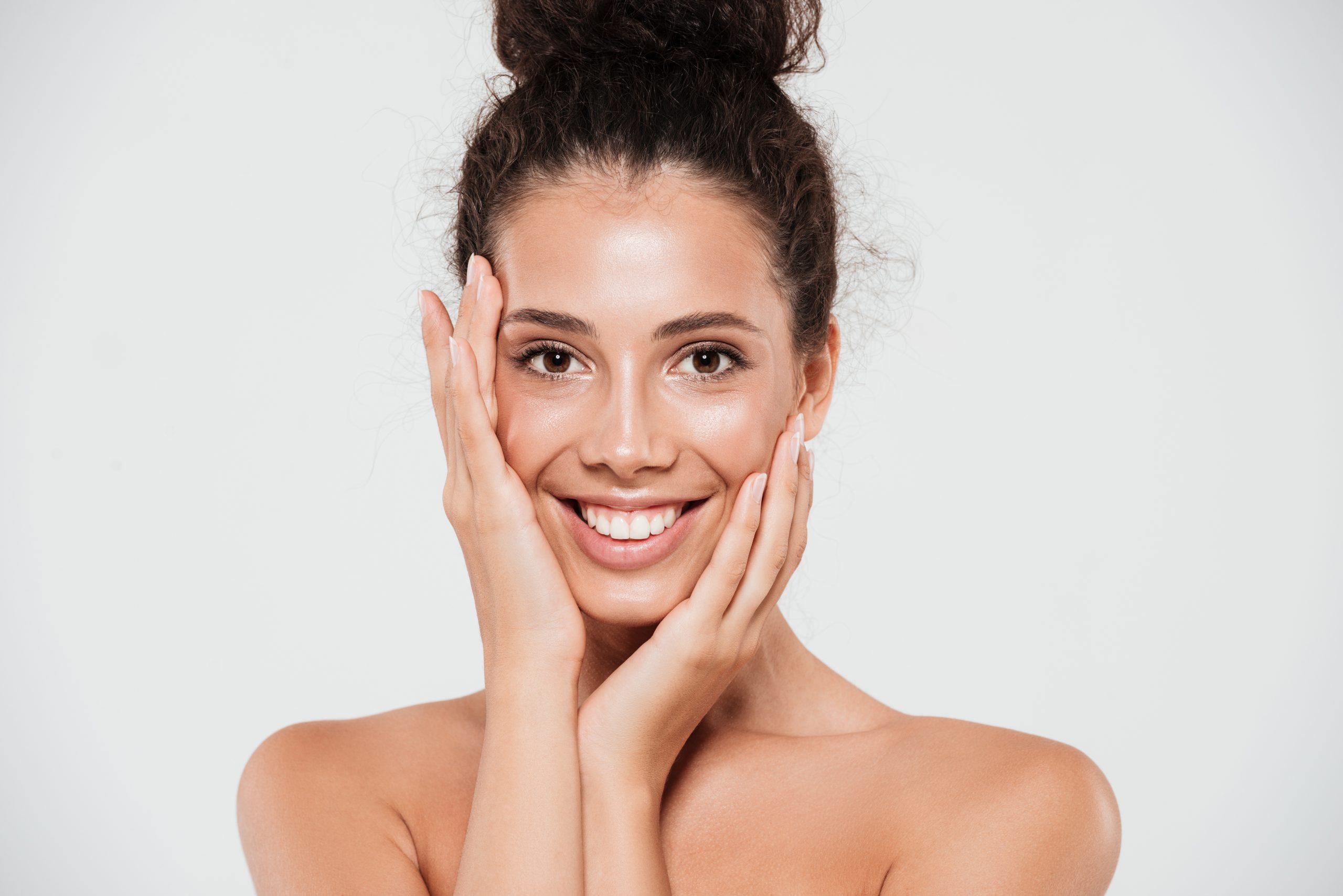 Beauty portrait of a smiling happy woman with darker skin no make up natural beauty